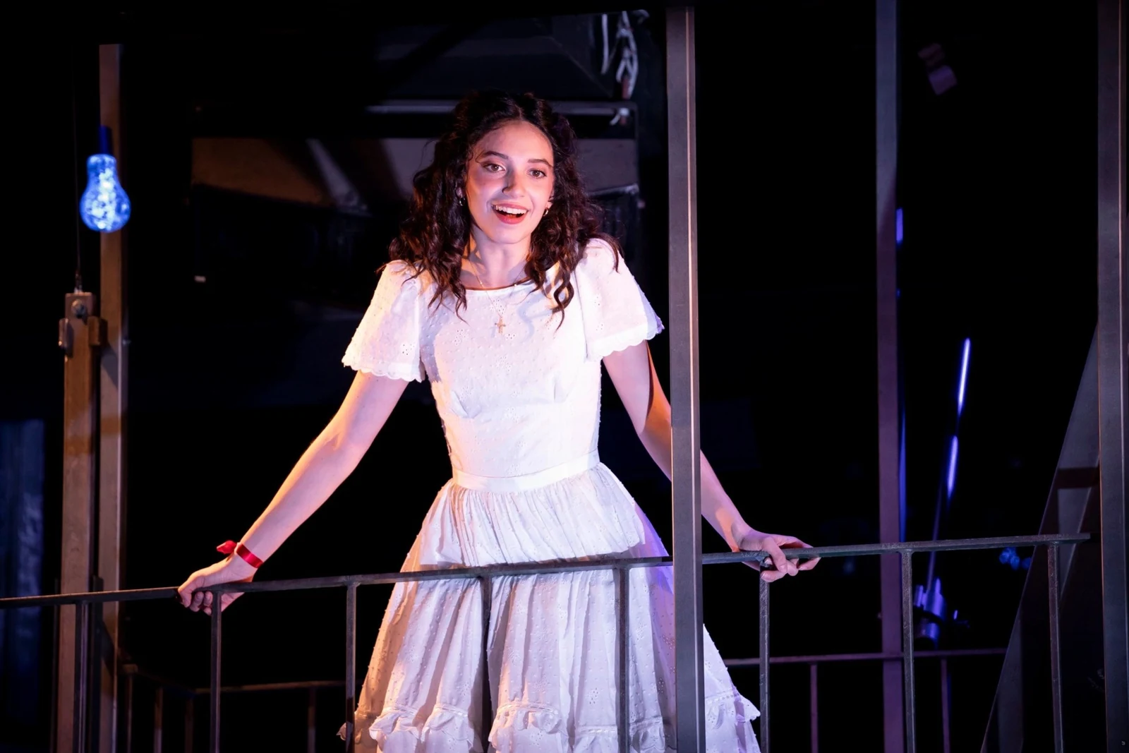 Lauren as Maria standing on the balcony in West Side Story